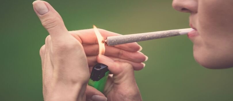 Enjoying a Packwood x Looseleaf THCA preroll outdoors